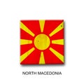 North Macedonia flag on a wooden block. Isolated on white background. Signs and symbols. Royalty Free Stock Photo