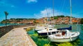 North macedonia. Ohrid. Different sail boats in dock on lake with buildings on hill Royalty Free Stock Photo