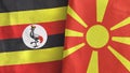 North Macedonia and Uganda two flags textile cloth 3D rendering