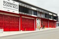 The North Metropolitan modern fire station with its large red doors and firemen sculptures