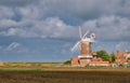 From the North Norfolk Coast Path, a view across the coastal wetlands and the Grade 2 listed tower mill at Cley next the Sea.
