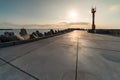 North pier with breakwaters, sunset seascape. Tetrapods along edges of pier. Beautiful evening seascape. Modern lighthouse in Royalty Free Stock Photo