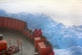 Icebreaker makes its way to North pole through pack ice. On bow of ship tourists, Ahead of rate is ice toros