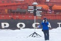 North pole. Tourists taking pictures on background of atomic icebreaker
