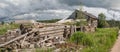 North Russian village Isady. Summer day, Emca river, old cottages on the shore, old wooden bridge. Abandoned building. Royalty Free Stock Photo