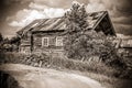 North Russian village Isady. Summer day, Emca river, old cottages on the shore, old wooden bridge. Abandoned building. Royalty Free Stock Photo