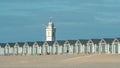 Holiday houses on the beach with white church tower Royalty Free Stock Photo