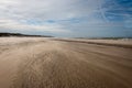 The North Sea beach on a sunny stormy winter day Royalty Free Stock Photo