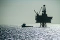 Silhouette of an Offshore Supply Vessel alongside oil platform Ringhorn in the North Sea Royalty Free Stock Photo