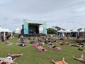 People rest in corpse pose at Catch the Vision outdoor yoga class