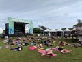 People stretch at Catch the Vision outdoor yoga class