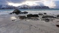 Rocks on Ramsberg beach on Flakstad island on the Lofoten islands in winter at sunset