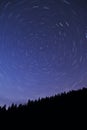 North - star strails over mountain forest