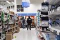 NORTH VANCOUVER, BC, CANADA - MAR 19, 2020: A security guard watches over shoppers at a local supermarket stocking up on Royalty Free Stock Photo