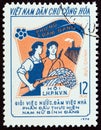 NORTH VIETNAM - CIRCA 1974: A stamp printed in North Vietnam shows Armed Worker and Peasant, circa 1974.