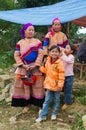 North Vietnamese women in colorful native clothing with children