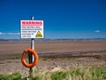 On the north west Cumbria Solway Coast, a sign warns of dangerous tides, sinking sand and mud at low tides.