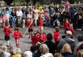 NORTHAM, DEVON, ENGLAND - APRIL 30 2022: Children perform the traditional Maypole dance at village May Day celebrations.