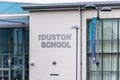 Northampton UK January 13 2018: Duston School Specialist College in Business Science Enterprise logo sign post Royalty Free Stock Photo
