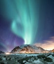 Northen light above mountains on the Lofoten islands.