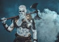 Northern undead with huge hatchet in frosty fog