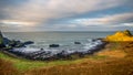 Northern Ireland Antrim Coast Ballintoy Harbour with rocks and sunset waves, beautiful scenery Royalty Free Stock Photo