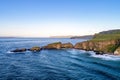 Atlantic coast in Northern Ireland with cliffs at Carrick-a-Rede rope bridge