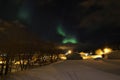 Northern Light above Gravdal's houses Royalty Free Stock Photo