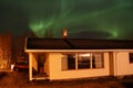 Northern Light above Lofoten's house Royalty Free Stock Photo