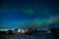 Northern Lights Also Known As Aurora, Borealis Or Polar Lights At Cold Night Over Igloo Village. Beautiful Night Photo