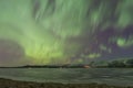 Northern lights Aurora Borealis above a countryside in Iceland Royalty Free Stock Photo