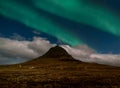 Northern lights aurora borealis appear over Mount Kirkjufell in Iceland. Royalty Free Stock Photo