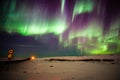 Northern Lights, Aurora Borealis - Iceland. Dramatic skyshow with rippling curtains of green and purple light Royalty Free Stock Photo