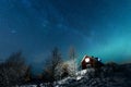 The northern lights Aurora Borealis and Milky Way at Kuukiuru village lake in Lapland, Finland