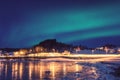 Scenic winter landscape with northern lights, Aurora borealis in night sky, Lofoten Islands, Norway Royalty Free Stock Photo