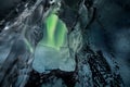 Northern lights aurora borealis over glacier ice cave. Royalty Free Stock Photo