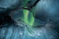 Northern lights aurora borealis over glacier ice cave. Royalty Free Stock Photo