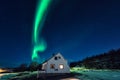 Northern lights aurora borealis over tourist camping in Lofoten islands, Norway. Night winter landscape