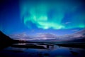 Northern lights dancing over calm lake aurora borealis