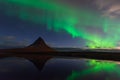 Northern lights in Iceland. Landscape full of kp5 Aurora Borealis. Amazing nightscape at Kirkjufell, scenic travel destination. Gr Royalty Free Stock Photo