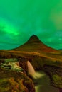 Northern lights in Iceland. Landscape full of kp5 Aurora Borealis. Amazing nightscape at Kirkjufell, scenic travel destination. Gr Royalty Free Stock Photo