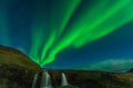 Northern lights in Iceland. Landscape full of kp5 Aurora Borealis. Amazing nightscape at Kirkjufell, scenic travel destination. Gr Royalty Free Stock Photo