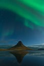 Northern lights in Iceland. Landscape full of kp5 Aurora Borealis. Amazing nightscape at Kirkjufell, scenic travel destination. Gr Royalty Free Stock Photo