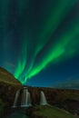 Northern lights in Iceland. Landscape full of kp5 Aurora Borealis. Amazing nightscape at Kirkjufell, scenic travel destination. Gr Royalty Free Stock Photo