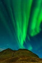 Northern lights in Iceland. Landscape full of kp5 Aurora Borealis. Amazing nightscape at Kirkjufell, scenic travel destination. Gr Royalty Free Stock Photo