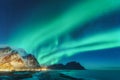 Northern lights in Lofoten islands, Norway. Green Aurora borealis