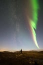 Northern lights and a man pointing