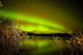 Northern lights mirrored on lake Royalty Free Stock Photo