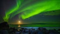 Northern lights and the moon at Uttakleiv Beach Royalty Free Stock Photo