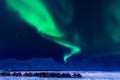 Northern lights in the mountains house of Svalbard, Longyearbyen city, Spitsbergen, Norway wallpaper Royalty Free Stock Photo